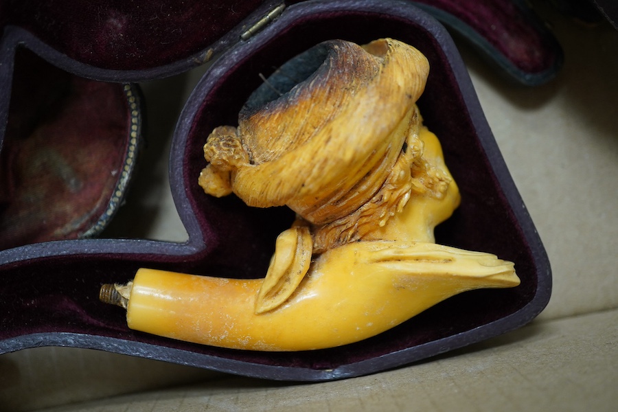 Six cased Meerschaum pipes and a cased amber and silver mounted pipe unused, together with smoking related books, longest pipe 17cm. Condition - most meerschaum pipes used therefore stained and smoking ends broken